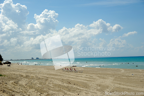 Image of sunbeds and costline  at tropical beach