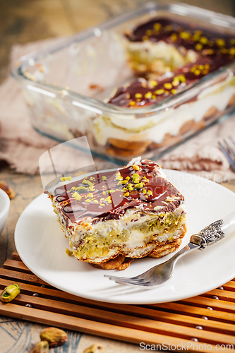 Image of Homemade tiramisu with pistachio mousse and dark chocolate