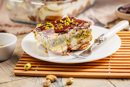 Image of Homemade tiramisu with pistachio mousse and dark chocolate