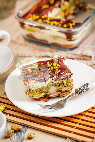 Image of Homemade tiramisu with pistachio mousse and dark chocolate