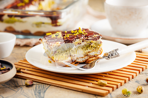 Image of Homemade tiramisu with pistachio mousse and dark chocolate