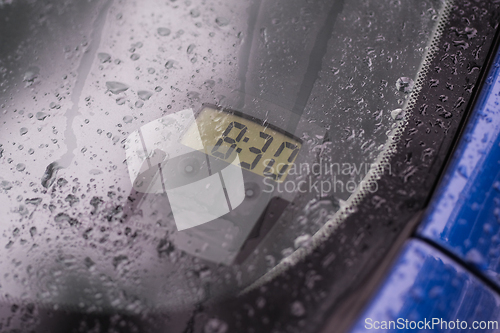 Image of Electric parking disc in a car