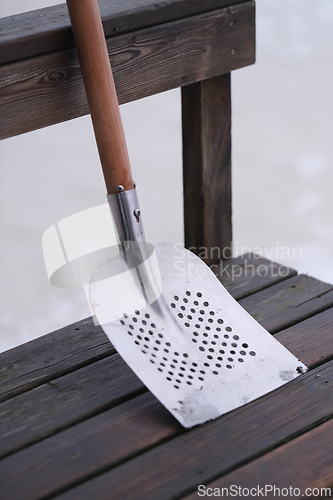 Image of Metal snow shovel with holes