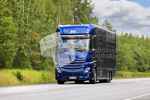 Image of Blue Mercedes-Benz Actros Krismar Horse Transporter on Road