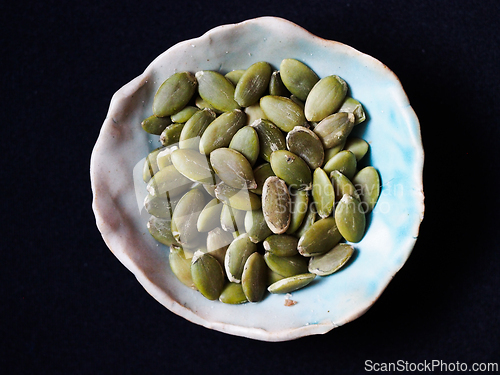 Image of Green pumpkin seeds in a bowl