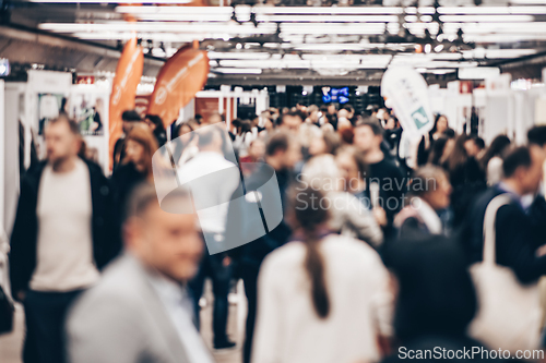Image of Abstract blurred people at exhibition hall of expo event trade show. Business convention show or job fair. Business concept background.
