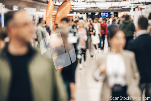 Image of Abstract blurred people at exhibition hall of expo event trade show. Business convention show or job fair. Business concept background.