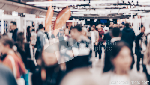 Image of Abstract blurred people at exhibition hall of expo event trade show. Business convention show or job fair. Business concept background.