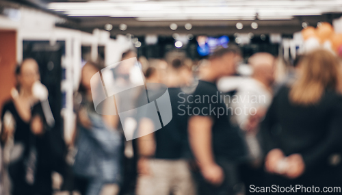 Image of Abstract blurred people at exhibition hall of expo event trade show. Business convention show or job fair. Business concept background.
