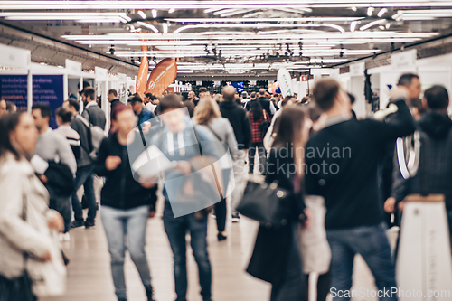 Image of Abstract blurred people at exhibition hall of expo event trade show. Business convention show or job fair. Business concept background.