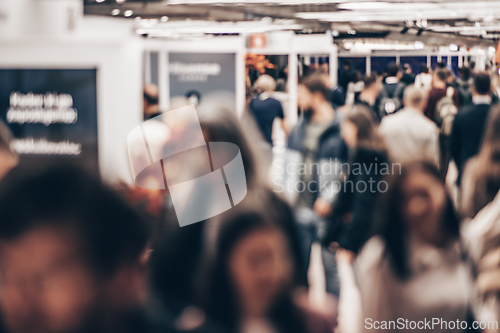 Image of Abstract blurred people at exhibition hall of expo event trade show. Business convention show or job fair. Business concept background.
