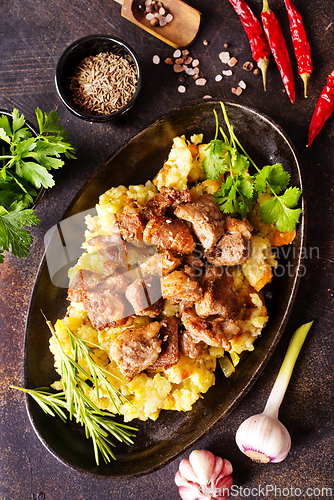 Image of Meat with prunes, goulash and mashed potatoes