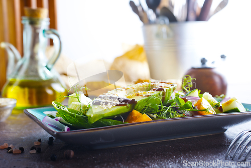Image of Fresh salad with avocado in a bowl. Healthy vegetarian dish