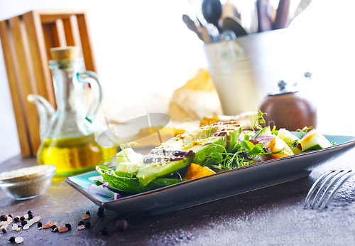 Image of Fresh salad with avocado in a bowl. Healthy vegetarian dish