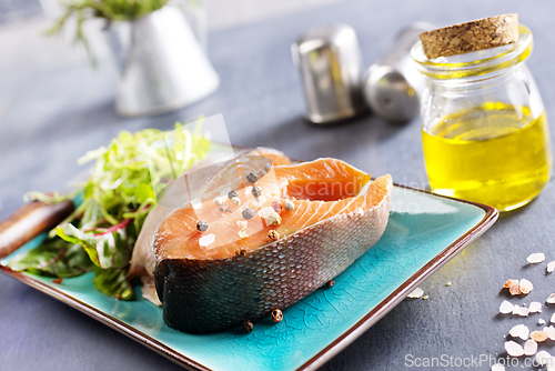 Image of Fresh raw salmon steak with spices. Healthy seafood food