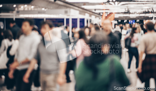 Image of Abstract blurred people at exhibition hall of expo event trade show. Business convention show or job fair. Business concept background.