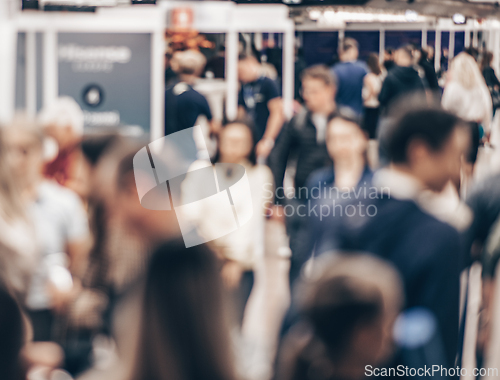 Image of Abstract blurred people at exhibition hall of expo event trade show. Business convention show or job fair. Business concept background.