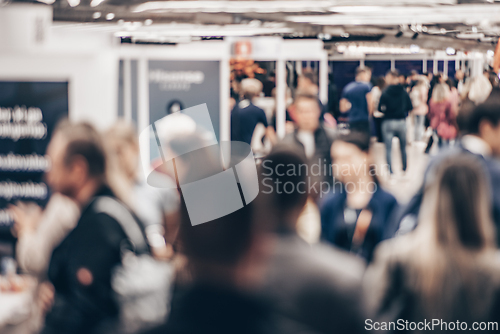 Image of Abstract blurred people at exhibition hall of expo event trade show. Business convention show or job fair. Business concept background.