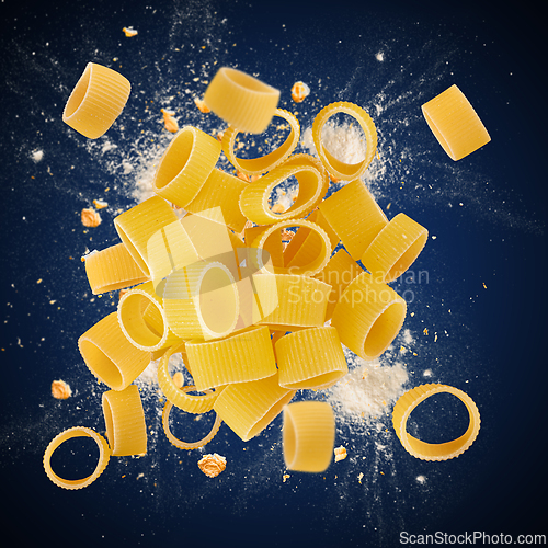 Image of Raw calamarata pasta is flying