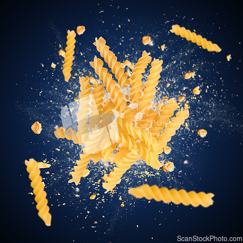 Image of Raw fusilli pasta is flying