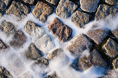 Image of Snow on a cobble stone road