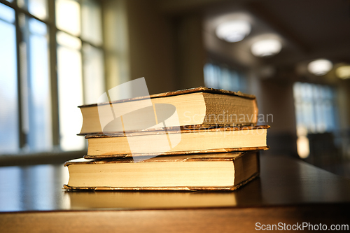 Image of A pile of three old books