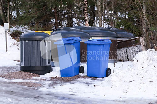 Image of Different garbage cans in winter