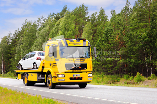 Image of MAN Flatbed Tow Truck Carrying Breakdown Car