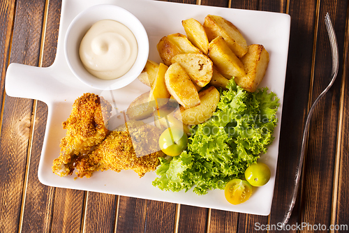 Image of roasted chicken wings with potato