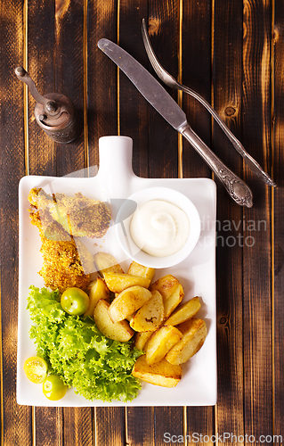 Image of roasted chicken wings with potato