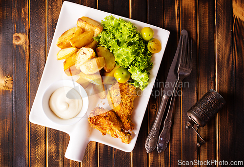 Image of roasted chicken wings with potato