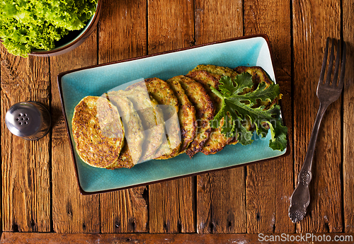 Image of Zucchini Fritters with Herbs and Cream Cheese Topping, Tasty Vegetable Pancakes
