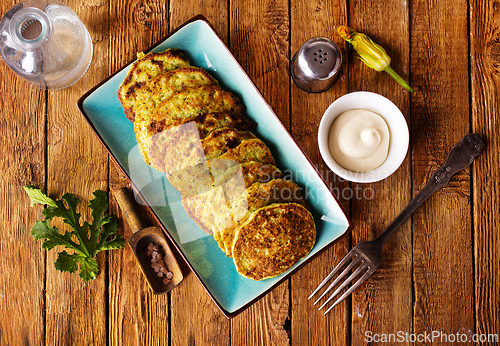 Image of Zucchini Fritters with Herbs and Cream Cheese Topping, Tasty Vegetable Pancakes