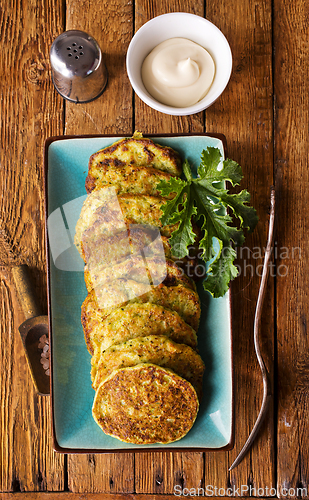 Image of Zucchini Fritters with Herbs and Cream Cheese Topping, Tasty Vegetable Pancakes