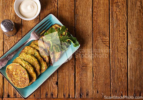 Image of Zucchini Fritters with Herbs and Cream Cheese Topping, Tasty Vegetable Pancakes