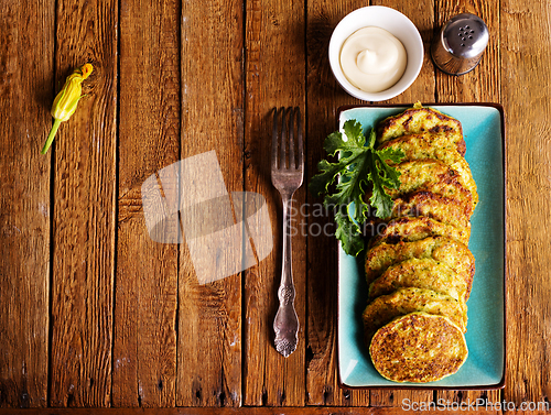Image of Zucchini Fritters with Herbs and Cream Cheese Topping, Tasty Vegetable Pancakes