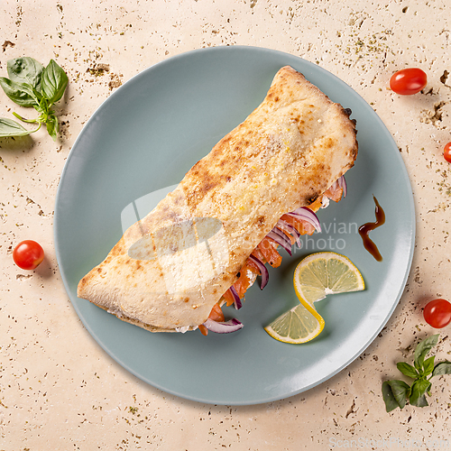 Image of Delicious closed calzone pizza
