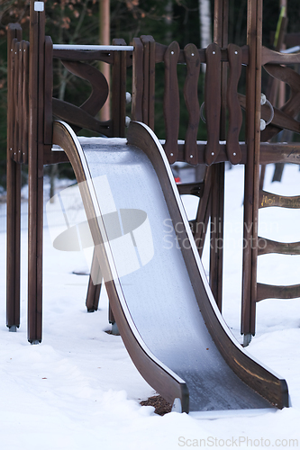 Image of Wooden slide on a playground