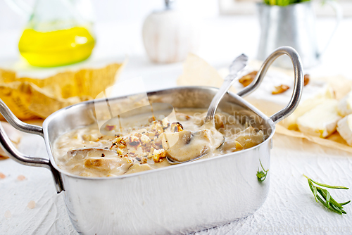 Image of Mushroom sauce in metal bowl