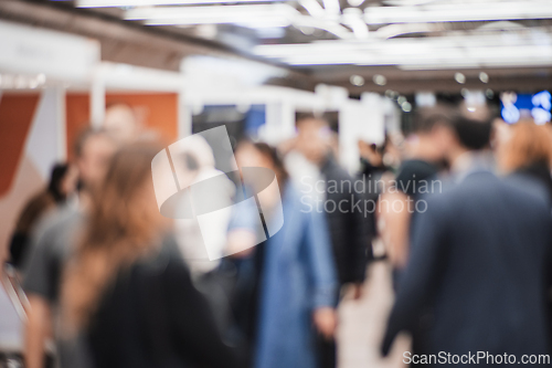 Image of Abstract blurred people at exhibition hall of expo event trade show. Business convention show or job fair. Business concept background.