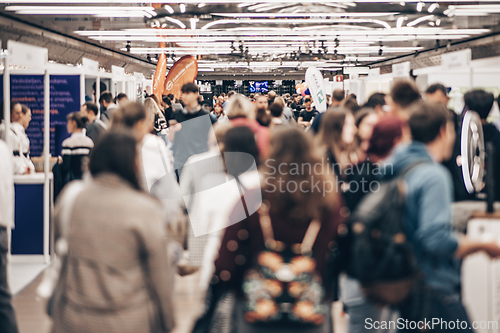 Image of Abstract blurred people at exhibition hall of expo event trade show. Business convention show or job fair. Business concept background.