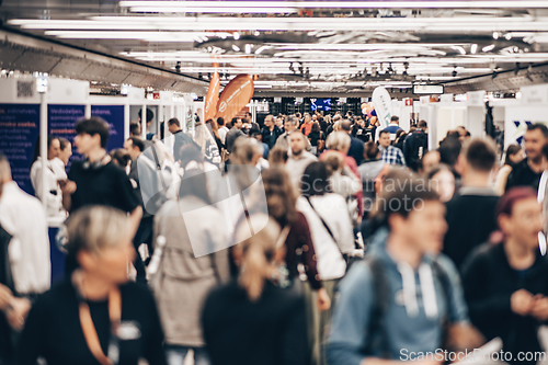Image of Abstract blurred people at exhibition hall of expo event trade show. Business convention show or job fair. Business concept background.