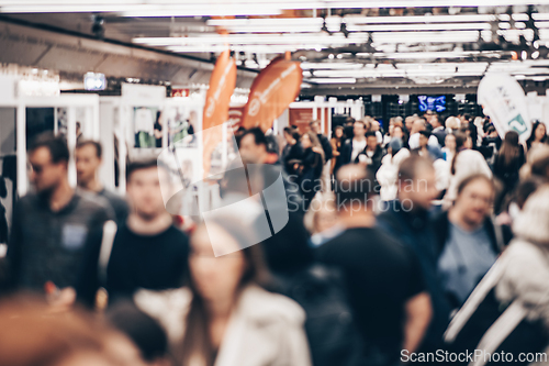 Image of Abstract blurred people at exhibition hall of expo event trade show. Business convention show or job fair. Business concept background.