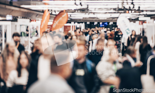 Image of Abstract blurred people at exhibition hall of expo event trade show. Business convention show or job fair. Business concept background.