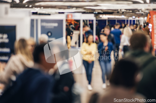 Image of Abstract blurred people at exhibition hall of expo event trade show. Business convention show or job fair. Business concept background.