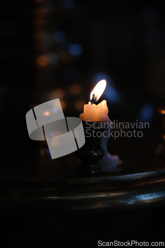 Image of A candle in the dark