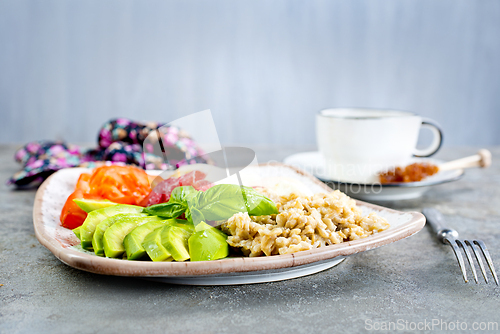 Image of Healthy breakfast. oat flakes with avocado