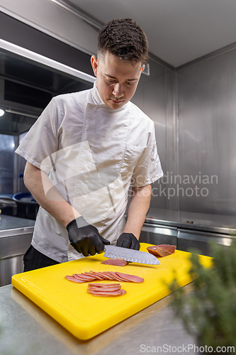 Image of Chef slicing meat