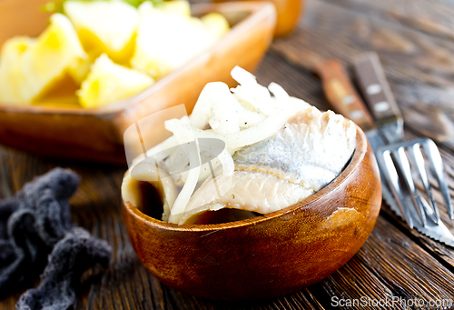 Image of Herring salad with boiled potatoes, pickled cucumbers and onion