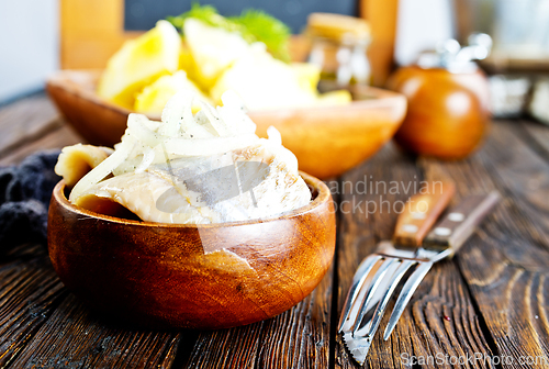 Image of Herring salad with boiled potatoes, pickled cucumbers and onion